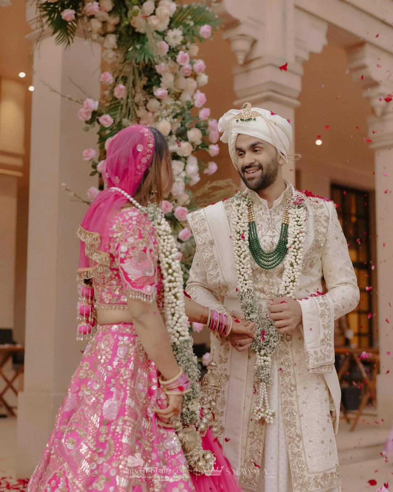 wedding safa wala in Fatehgunj – Close detail of a red wedding safa with an emerald kalgi